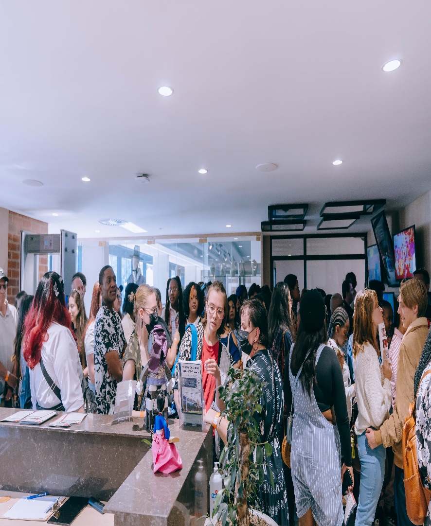 A group of people in a room

Description automatically generated with medium confidence