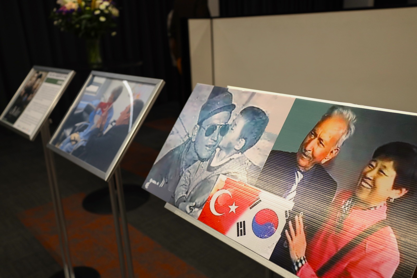 A group of pictures on a stand

Description automatically generated