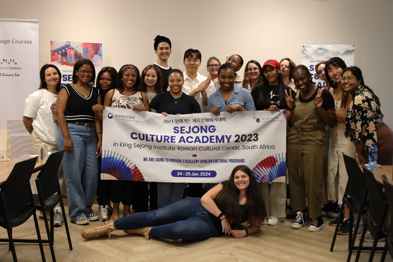 A group of people posing for a photo
Description automatically generated