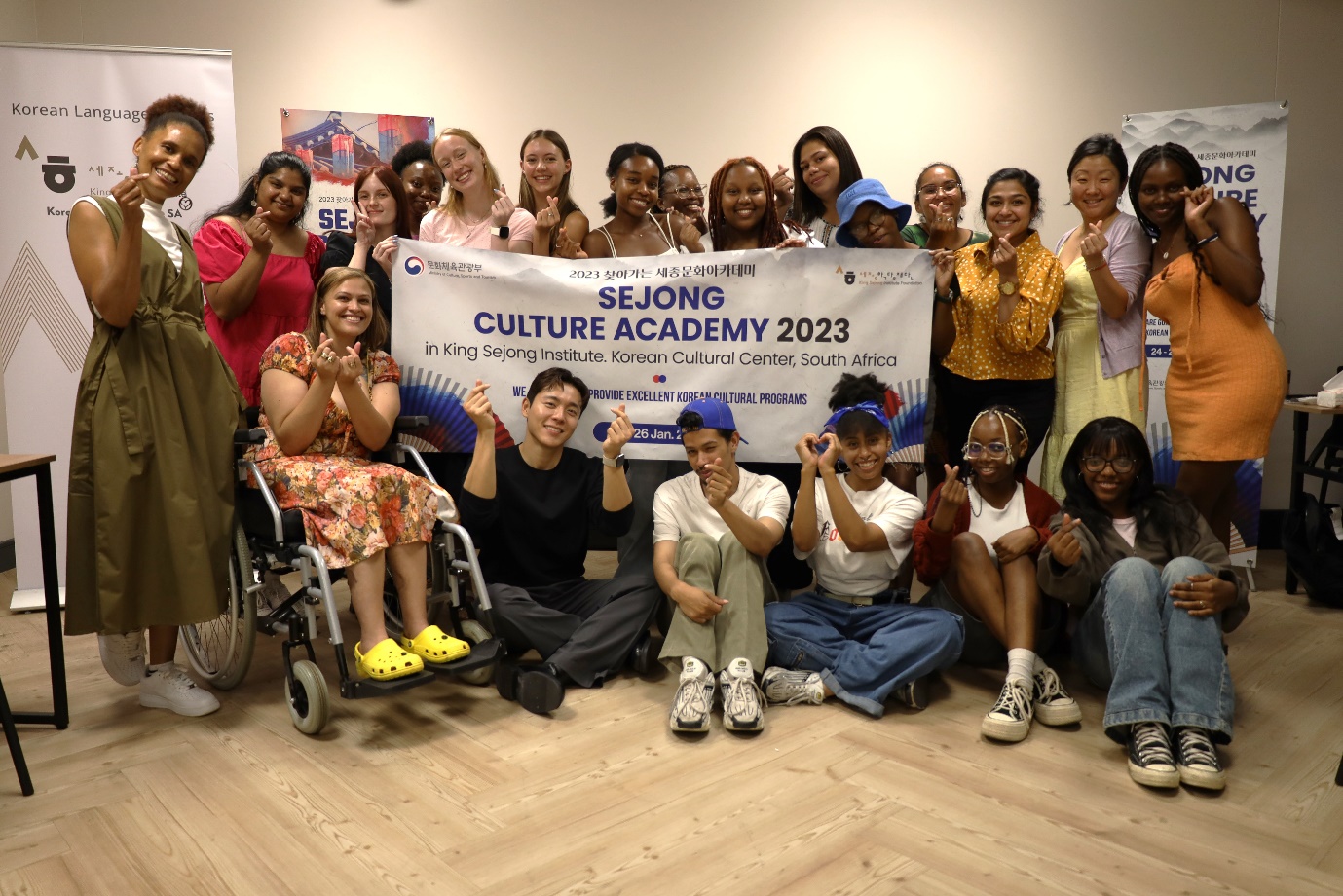 A group of people posing for a photo

Description automatically generated