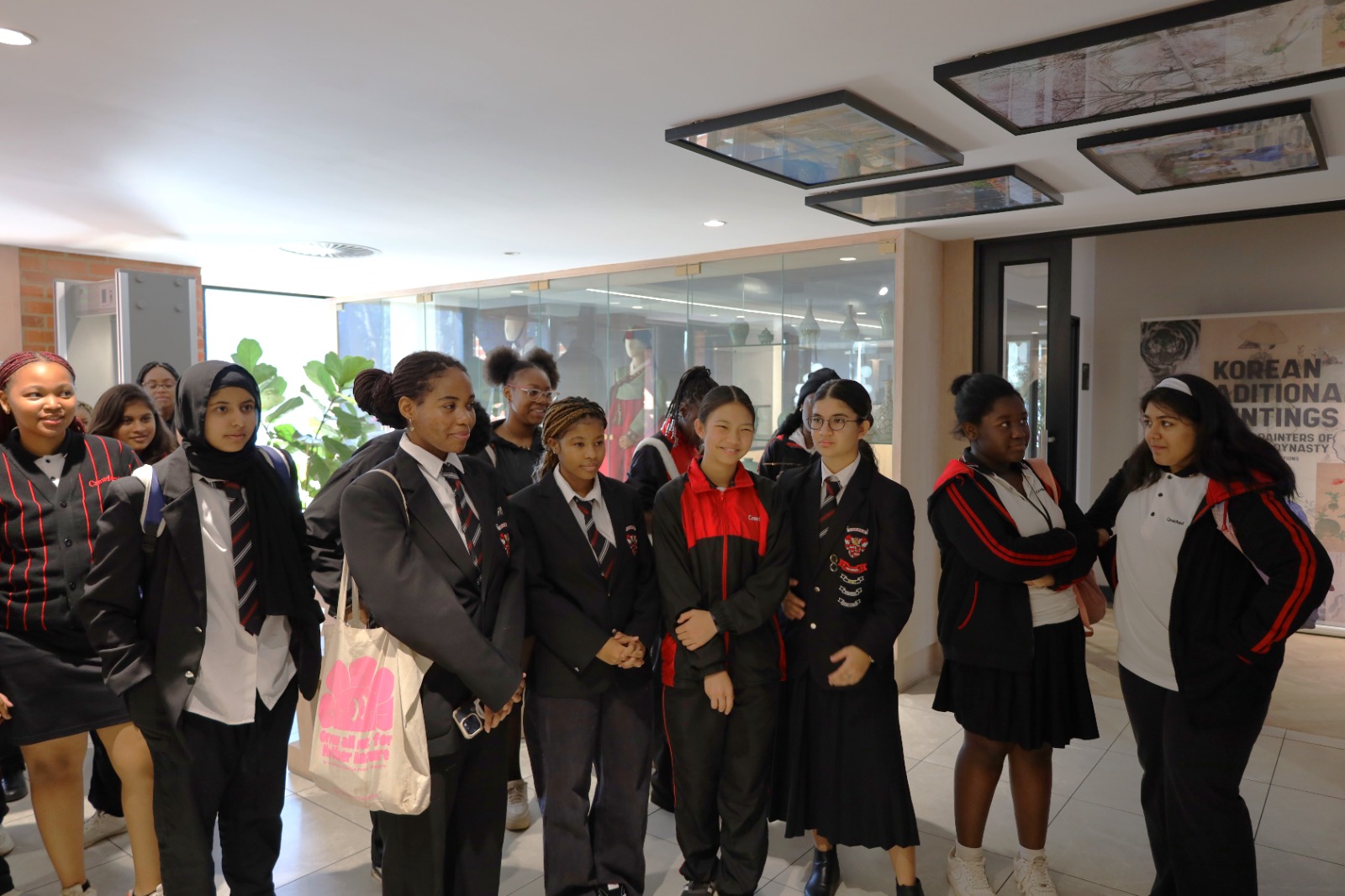 A group of young women in uniform

Description automatically generated