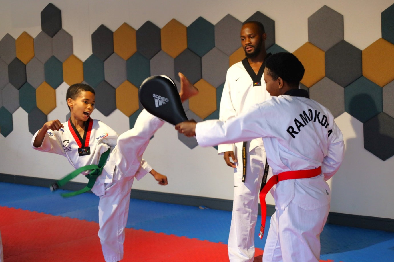 A group of kids practicing karate

Description automatically generated