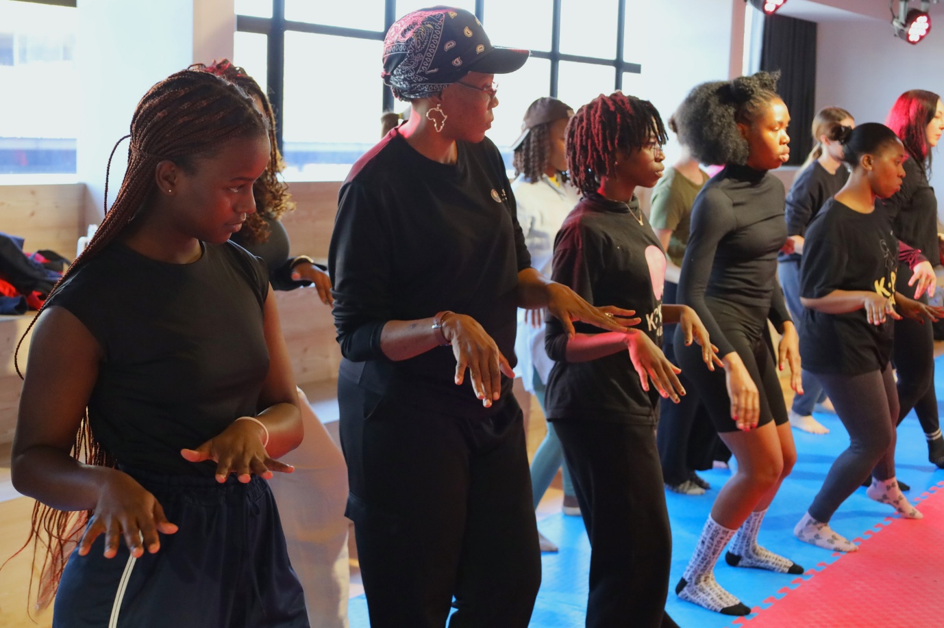 A group of women dancing
AI-generated content may be incorrect.