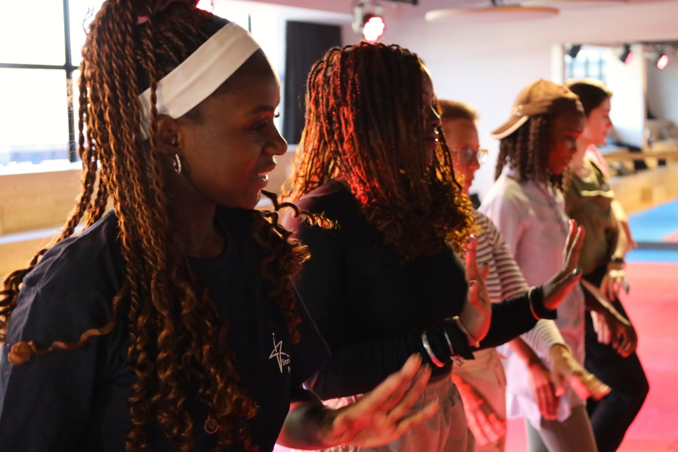 A group of people dancing
AI-generated content may be incorrect.