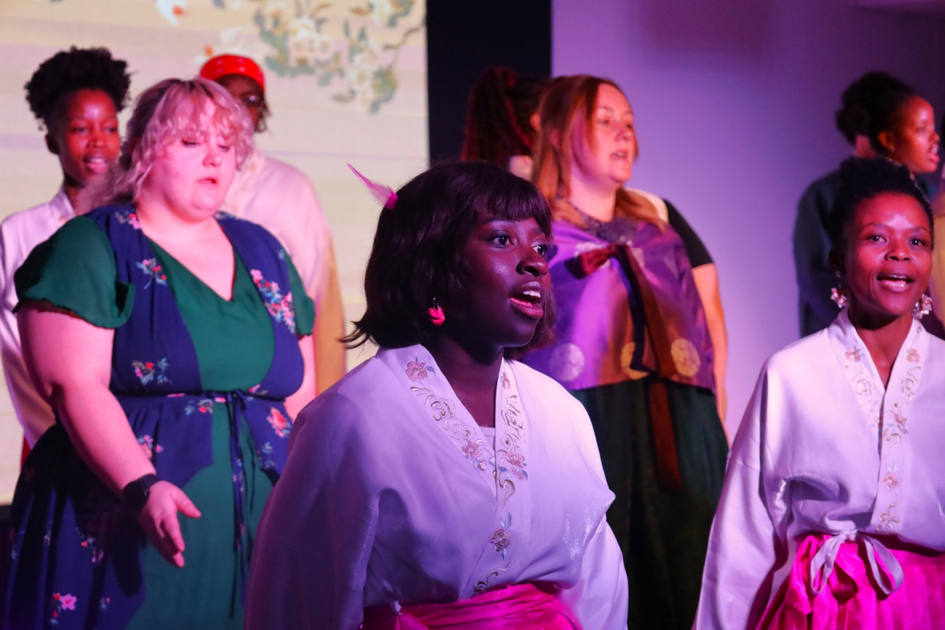 A group of people on a stage
AI-generated content may be incorrect.