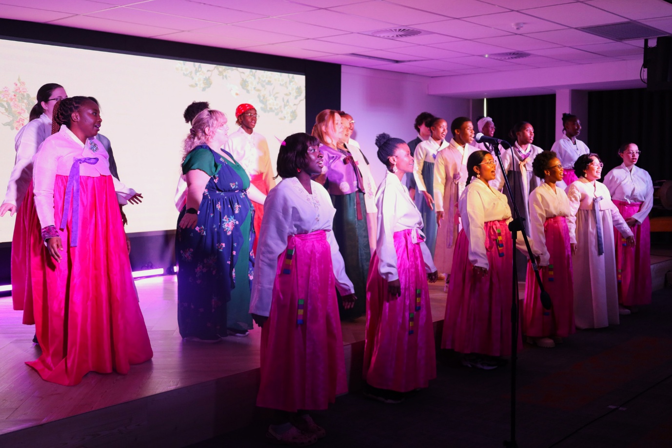 A group of people in long dresses
AI-generated content may be incorrect.