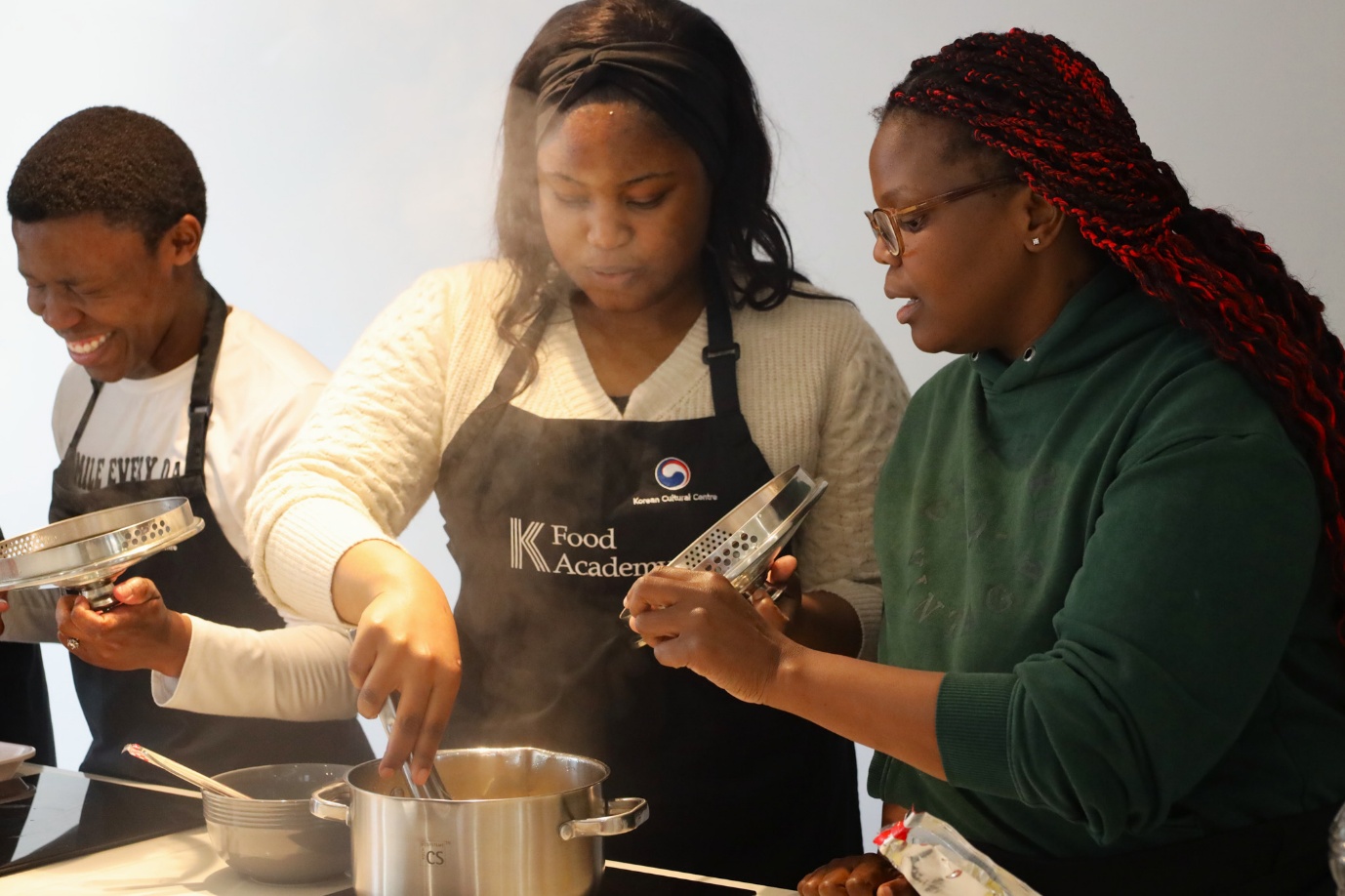 A group of people cooking
AI-generated content may be incorrect.