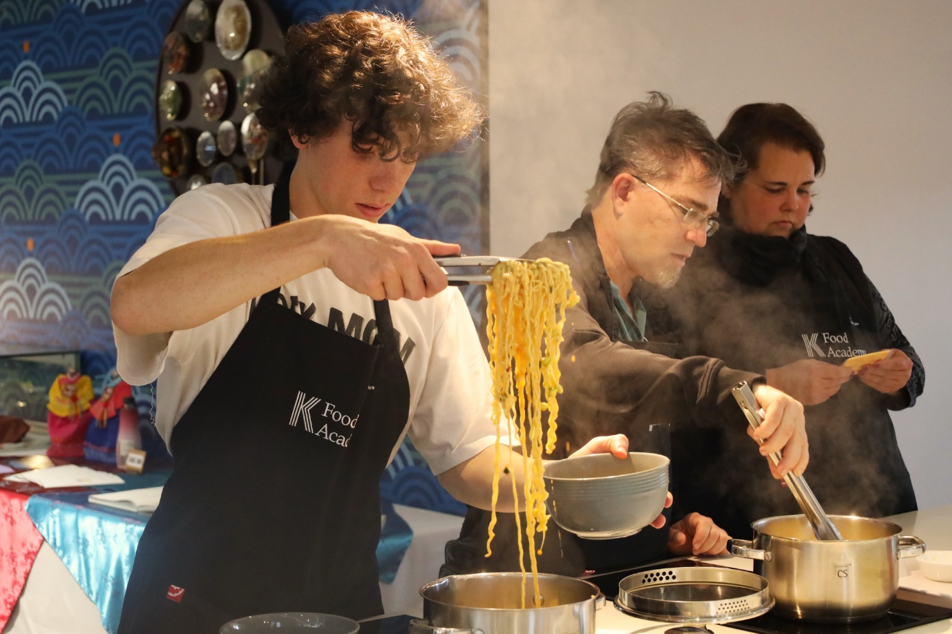 A group of people cooking
AI-generated content may be incorrect.