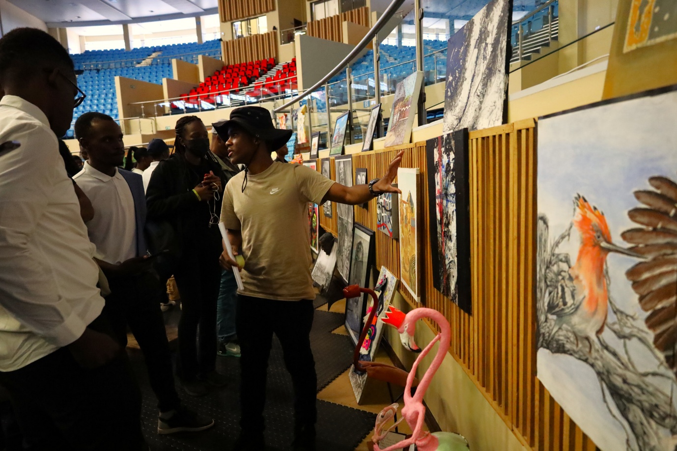 A group of people looking at art
AI-generated content may be incorrect.