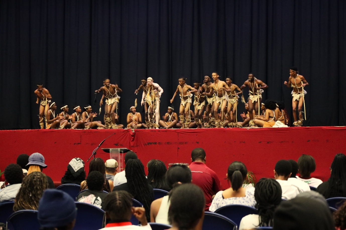 A group of people performing on stage
AI-generated content may be incorrect.