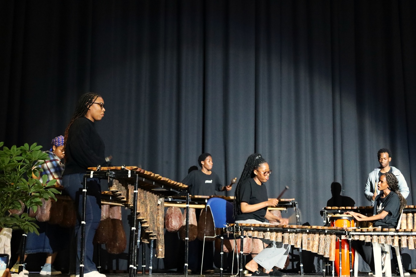 A group of people playing instruments
AI-generated content may be incorrect.