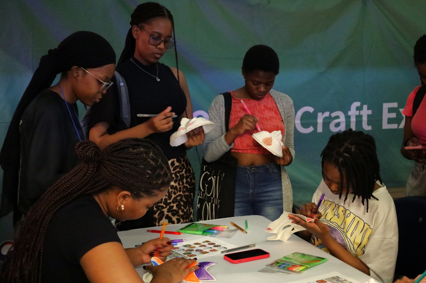 A group of women working on crafts
AI-generated content may be incorrect.