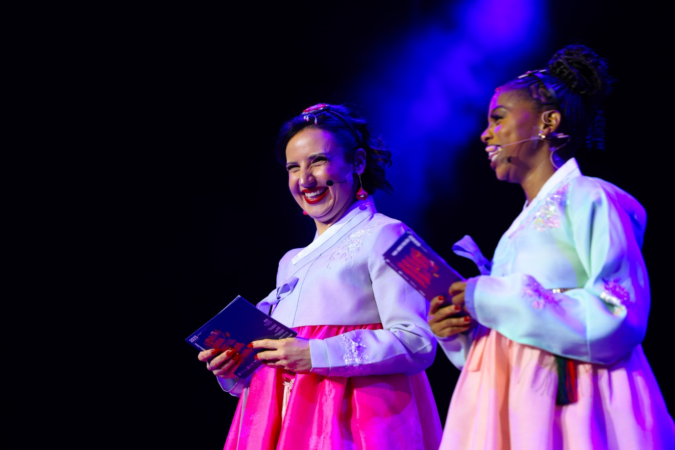 A group of women on stage

AI-generated content may be incorrect.