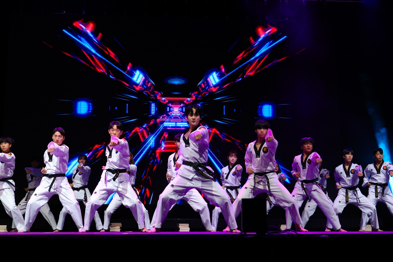 A group of people in white uniforms on a stage

AI-generated content may be incorrect.