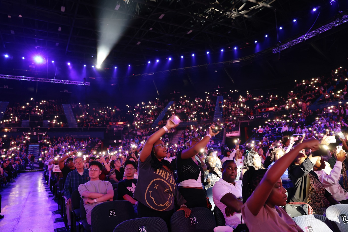 A group of people in a stadium

AI-generated content may be incorrect.