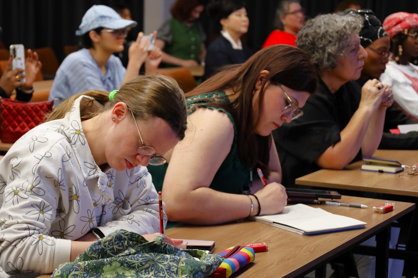A group of people sitting at desks
AI-generated content may be incorrect.