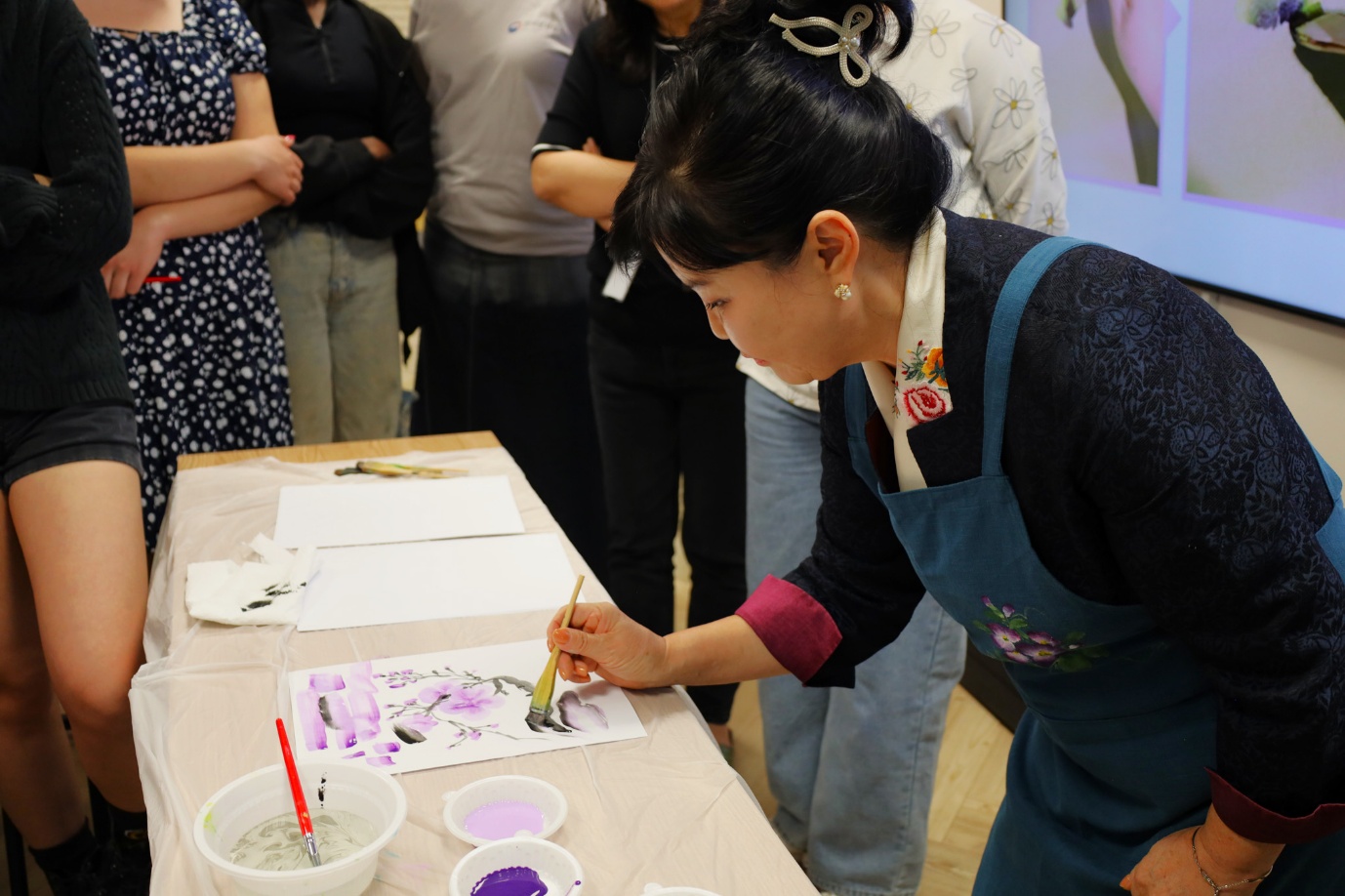 A person painting a picture
AI-generated content may be incorrect.