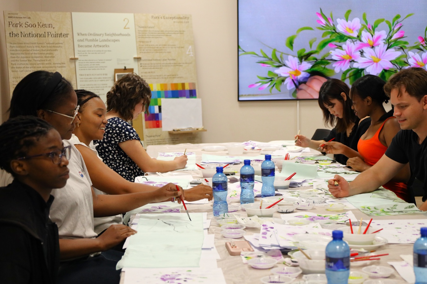 A group of people sitting at a table
AI-generated content may be incorrect.