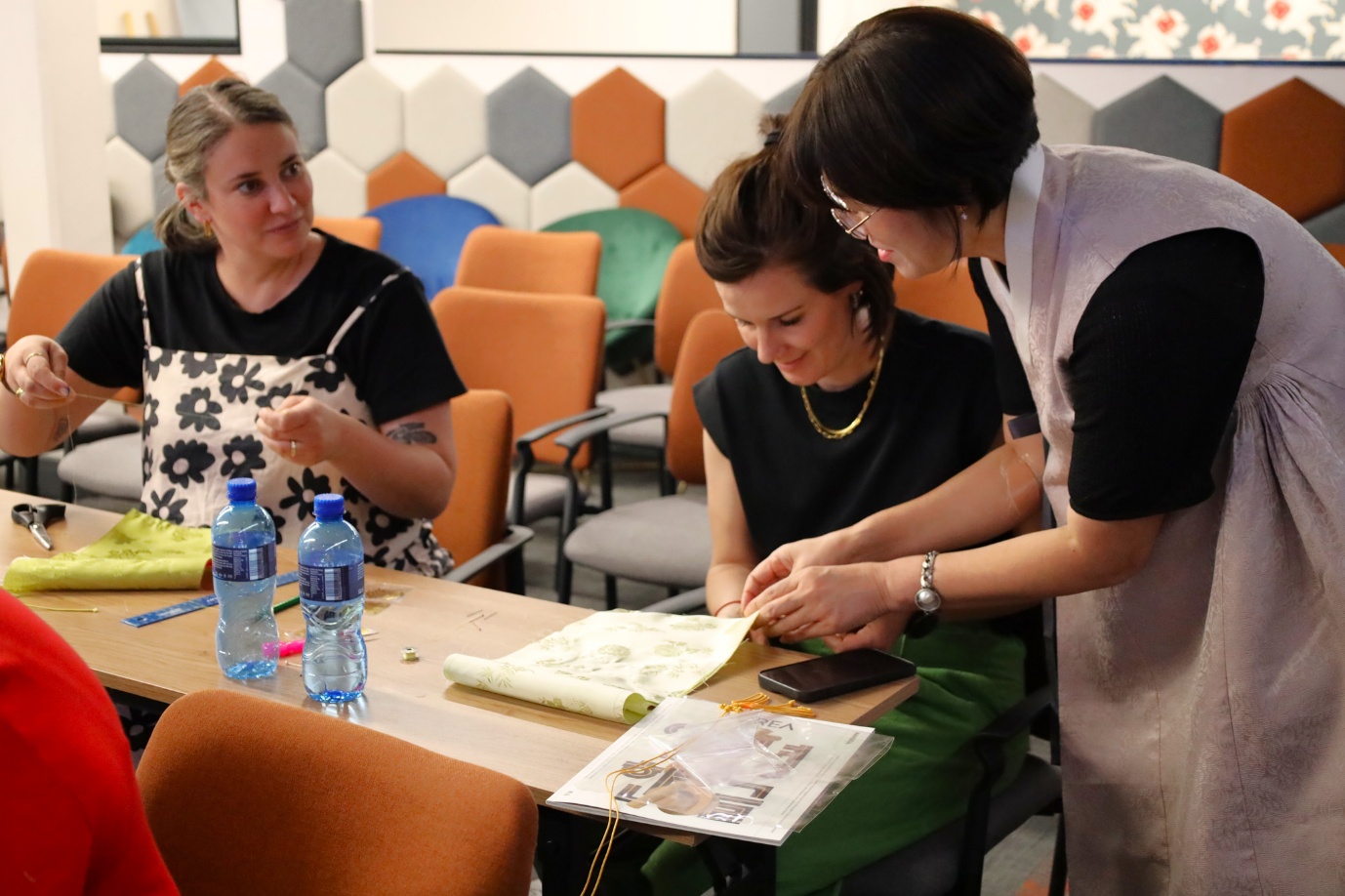 A group of women looking at a paper
AI-generated content may be incorrect.