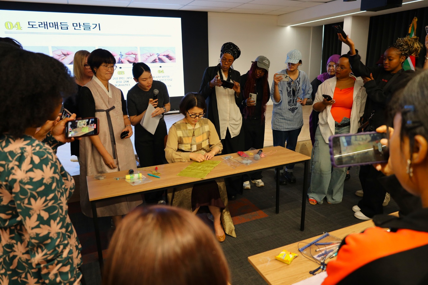 A group of people in a room
AI-generated content may be incorrect.