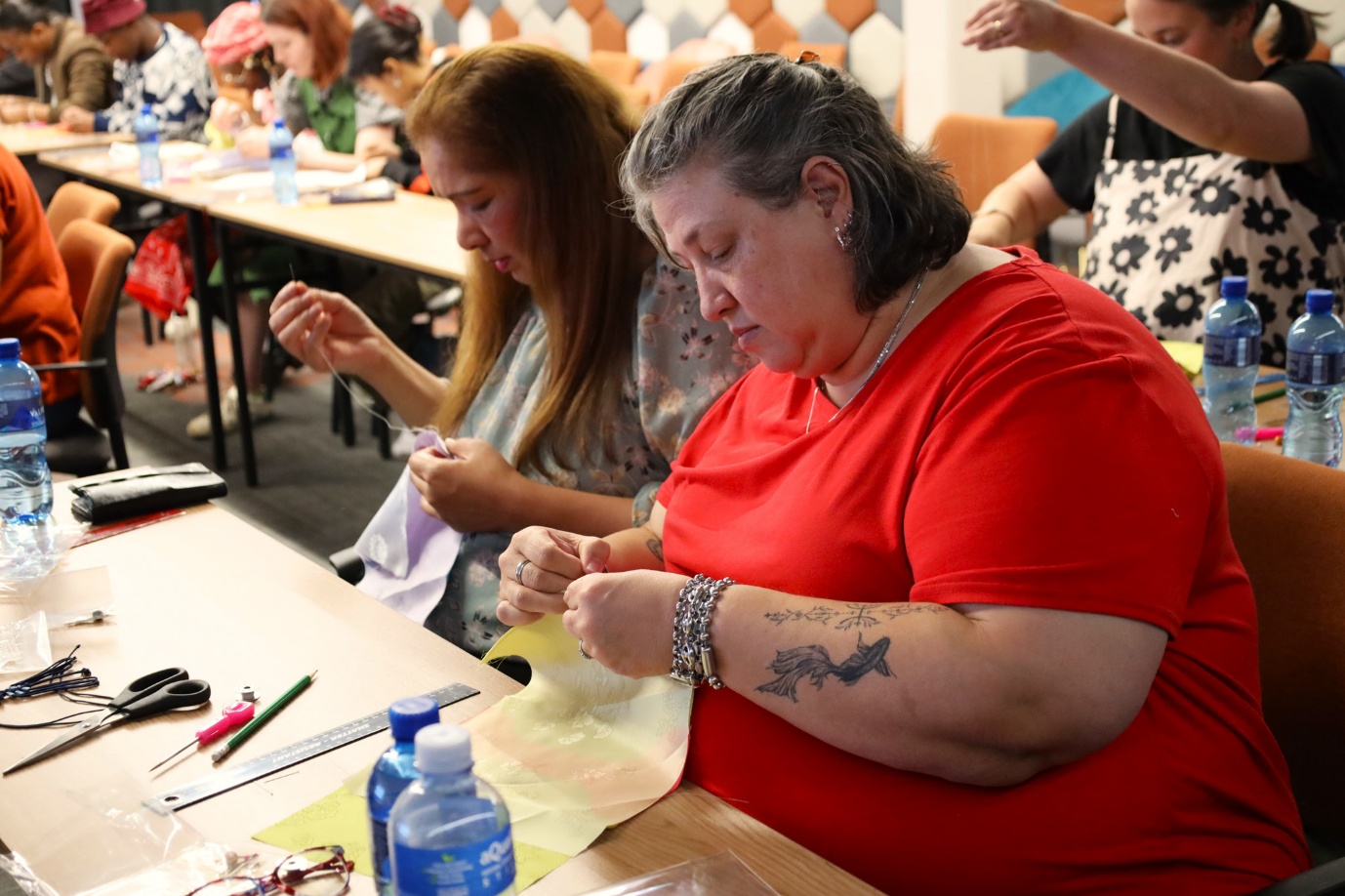 A group of women sewing
AI-generated content may be incorrect.