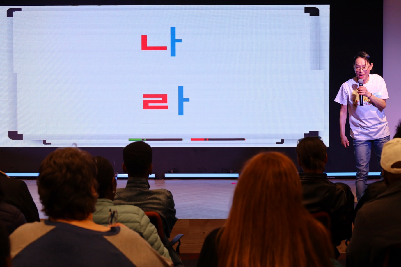 A group of people sitting in chairs watching a presentation

AI-generated content may be incorrect.