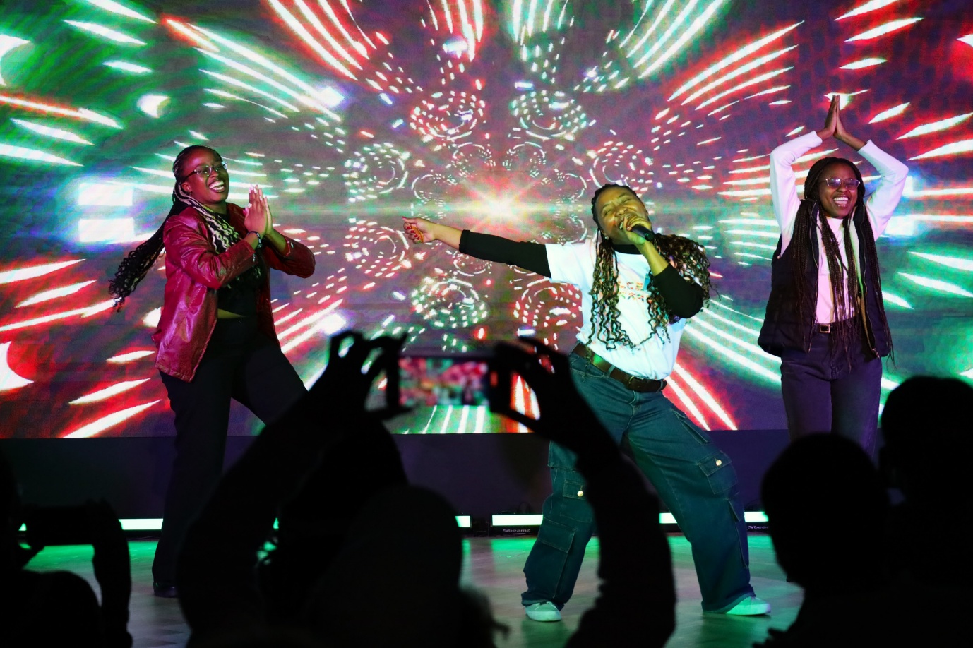 A group of women performing on stage

AI-generated content may be incorrect.