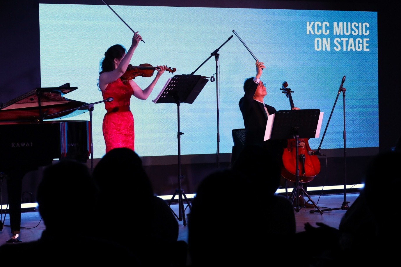 A group of people playing instruments

AI-generated content may be incorrect.