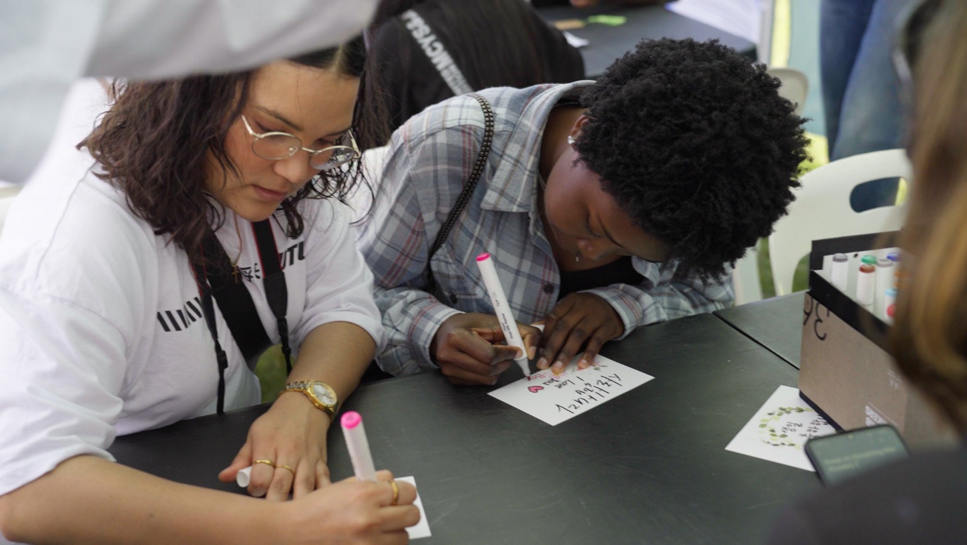 A group of students writing on paper

AI-generated content may be incorrect.