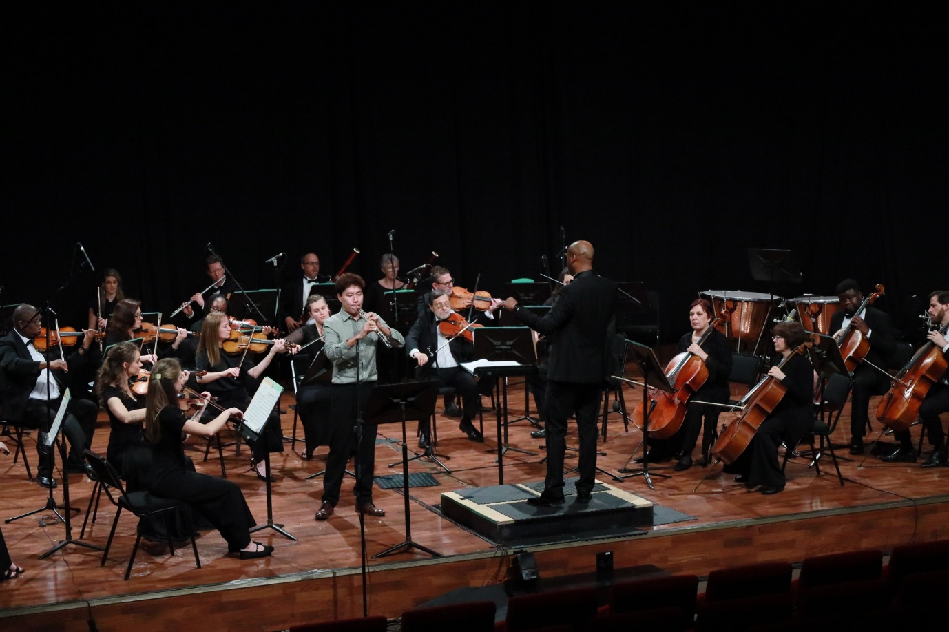 A group of people playing instruments

AI-generated content may be incorrect.